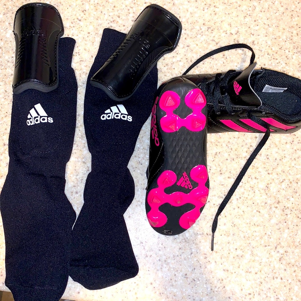 Girls soccer cleats and shin guards